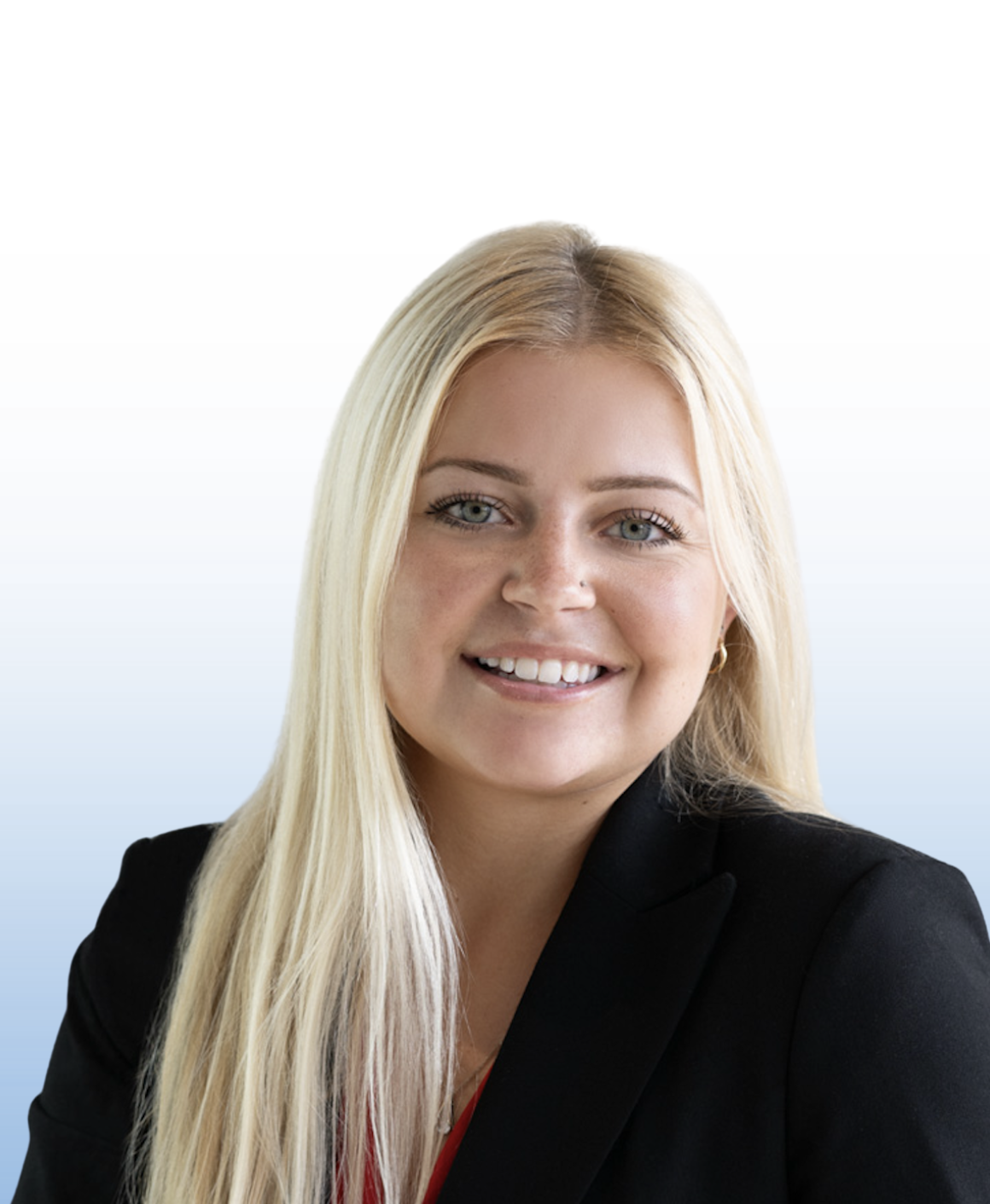 Smiling female Equity commercial real estate professional in black blazer, studio headshot