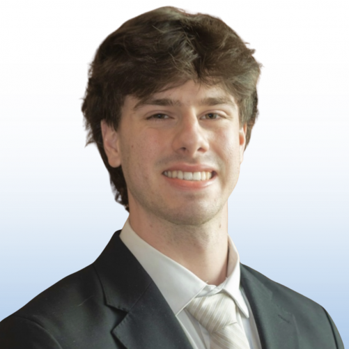Male Equity commercial real estate advisor in dark suit and striped tie, studio headshot