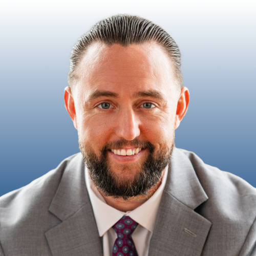 Michael Taylor, commercial real estate professional at Equity, smiling in a gray suit with a patterned tie