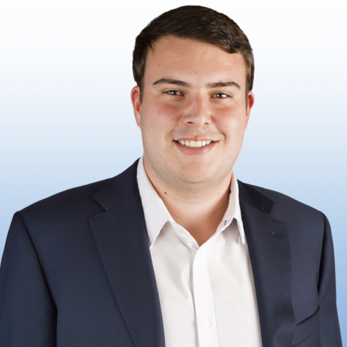 Equity team member in a navy suit and white dress shirt