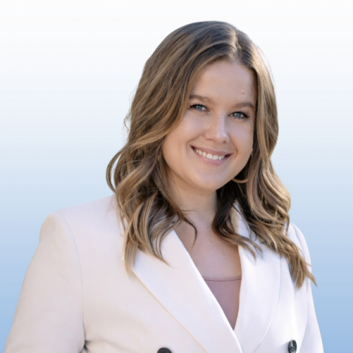 Professional headshot of a smiling Equity team member in a white blazer