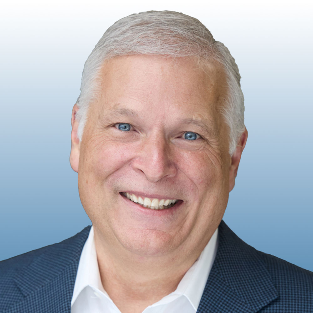 Mark Sneed Male in a blue blazer with white hair.