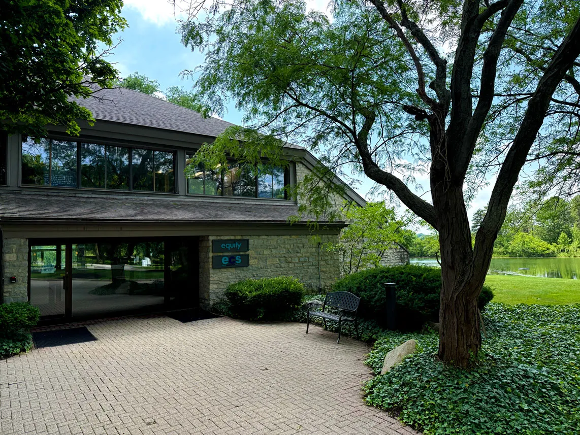 Entrance to Equity's Hilliard, Ohio headquarters beside a tree-lined pond