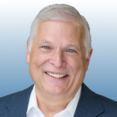 Mark Sneed Male in a blue blazer with white hair.